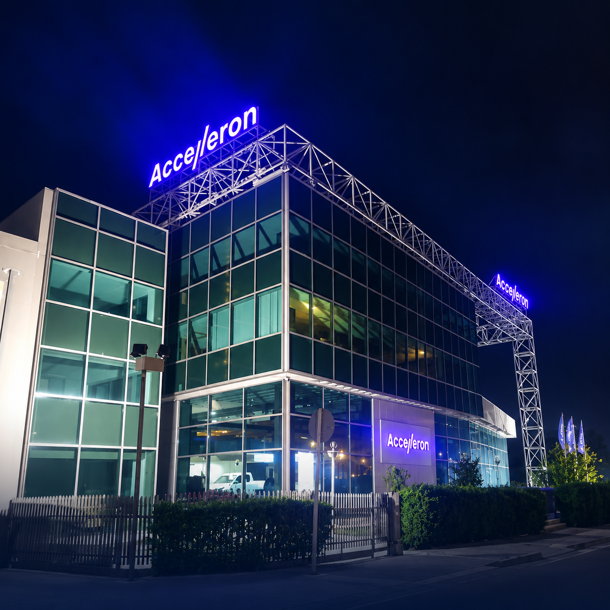 Crane lifting Accelleron sign lettering into place on the headquarters building facade