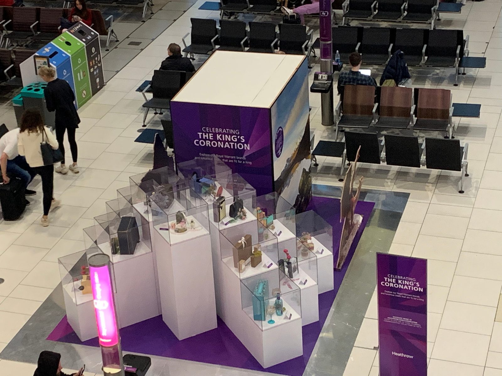 Celebrating the King's Coronation royal memorabilia display cube in a Heathrow departure lounge