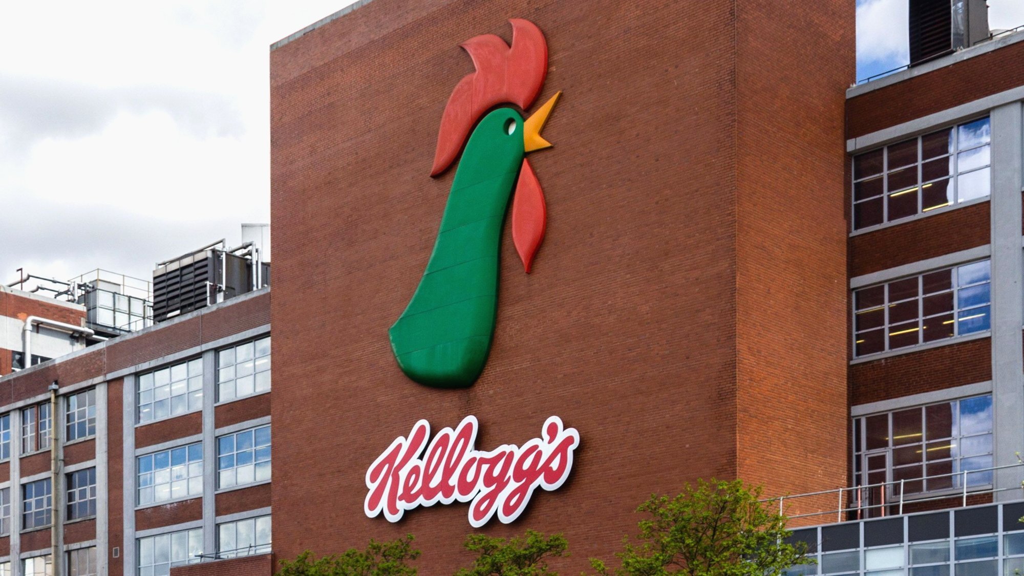 Kellogg's factory building exterior in Manchester with the rooster logo on brick wall